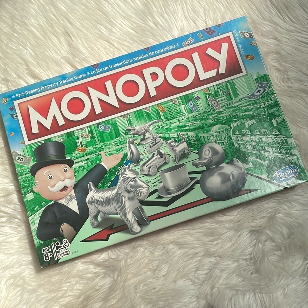 Monopoly fast dealing trading game with T-Rex token